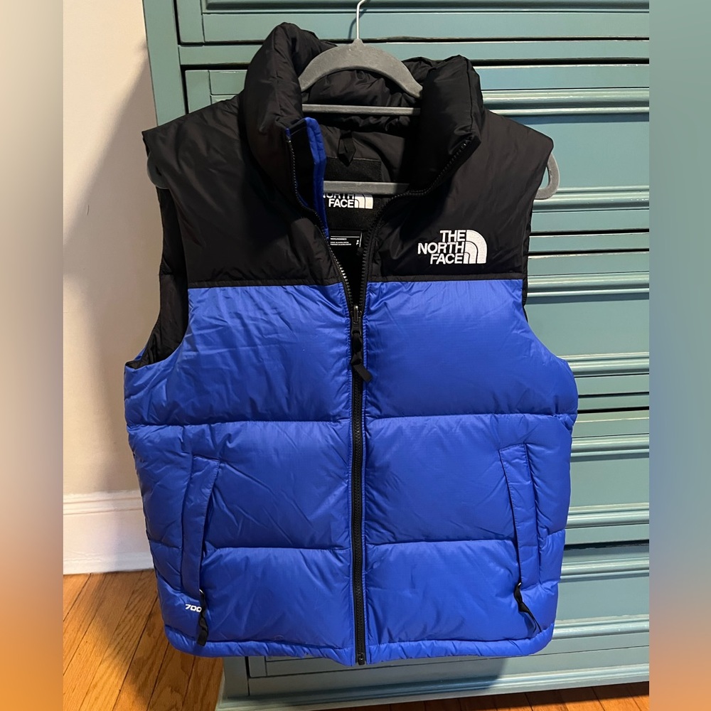 North face nuptuse blue and black vest men’s small / women’s medium